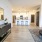 dresser, kitchen island with barstools, couch seating