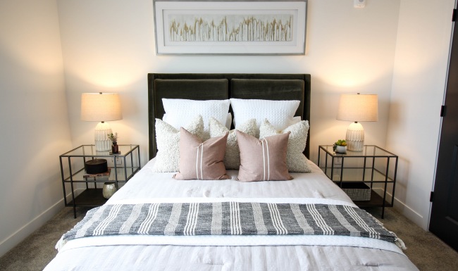 Bed with pillows and nightstand